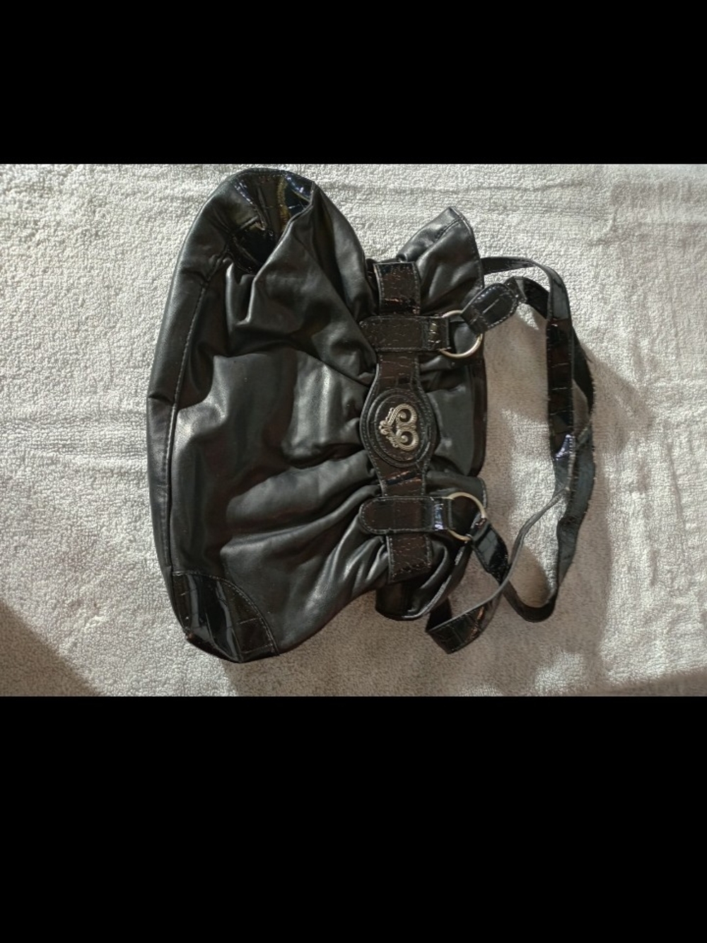 Black Women's Shoulder Bag with Decorative Emblem